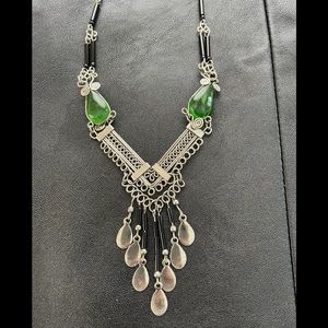 Silver tone necklace with black tube beads and green stones